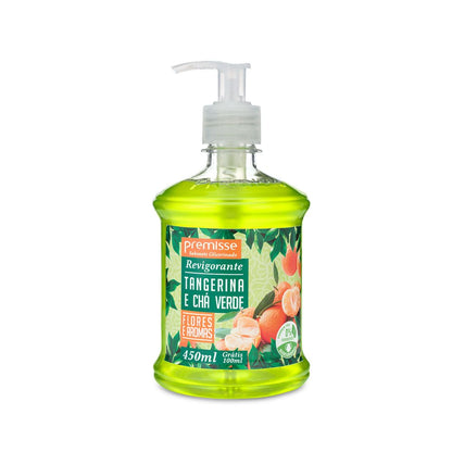 Frasco de Sabonete Líquido Revigorante Premisse 'Tangerina e Chá Verde' de cor verde limão, com válvula pump branca. O frasco contém 450ml (mais 100ml grátis) e o rótulo destaca 'Flores e Aromas' e a certificação de 98% de ingredientes de origem natural.